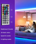 Indoor RGB LED Strip Lights 16.4ft 5050 SMD With Remote and 24V Power Adapter in living room with woman holding remote