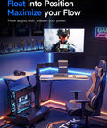 Level Up Your Setup With One Touch Electric Height Adjustable Mobile Gaming Desk Featuring Floating Shelf Dedicated CPU Stand Three Posture Modes And Built In Power Strip, showcasing gaming setup with CPU stand and ergonomic chair.