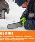 Person using Three Piece Chainsaw Sharpening File Set With Easy Grip Plastic Handles on a chainsaw blade in the snow