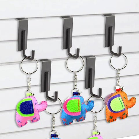 Heavy Duty Slatwall Hooks Built Like A Tank With Slick Scratch Resistant Coating showcasing colorful keychains on a slatwall.