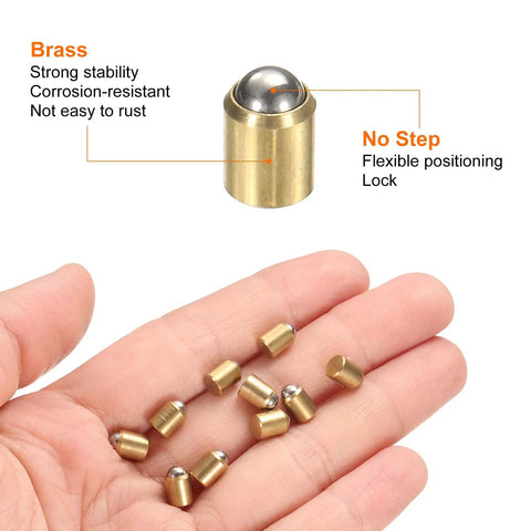 10 Pack Brass Ball Spring Plungers 5X6MM No Step Positioning Pins with hardened steel balls and brass housing in hand.