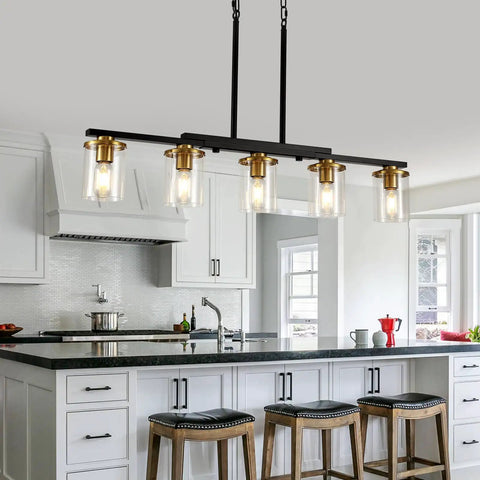 Top Notch Five Light Dining Room Fixture Featuring Clear Glass Shades That Give Any Kitchen Island A Kickin Farmhouse Chandelier Vibe While Building Sweet Warm Ambiance For Gatherings in modern kitchen setting.