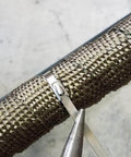 Close-up of 304 Stainless Steel Zip Tie 11.8 Inch Heavy Duty Built To Last Self Locking Cable Ties securing an exhaust wrap.