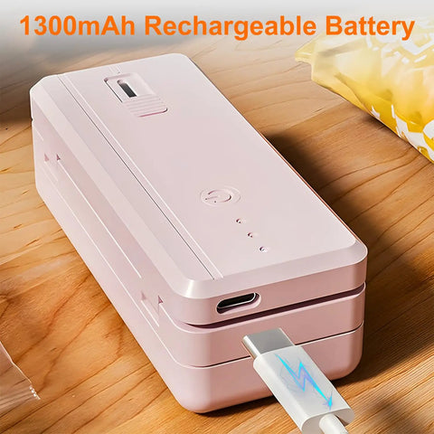 2 In 1 Bag Sealer And Cutter Portable USB Rechargeable Heat Sealer with magnetic resealer, shown charging on a wooden surface.
