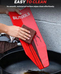 Person cleaning red steel funnel in a Spill Free Oil Change Kit With Steel Funnel, 14.6 Inch And 26.2 Inch Hoses, Reusable Flexible Funnel.