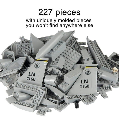 227 pieces of F-15 Eagle Fighter Jet Building Block Set With 227 Pieces For Ages 10 And Up And Adults Realistic Plane Toy Dope Build Compatible With All Building Bricks scattered on white background.