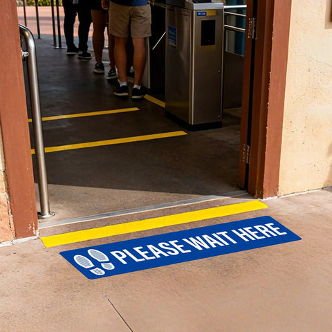 Five Piece Please Wait Here Floor Sign Kit 26 By 6 Inches Self Adhesive Waterproof Vinyl, Durable Social Distancing Markers For Queues And Waiting Areas, Multipack Signage For Busy Shops. Blue floor sign by entrance marking queue space