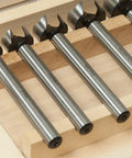 Top Shelf High Speed Steel Forstner Bit Set With Adjustable Depth Stop Collar For Smooth Drilling On Coin Sizes Penny Nickel Dime Quarter Half Dollar And DIY Household Projects showcasing six HSS bits labeled by coin size.