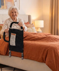 Senior using Dual Handle Bed Rail for Seniors With Padded Grips, Storage Pocket, and 300 Lbs Capacity, No Fuss Tool Free Assembly, Black