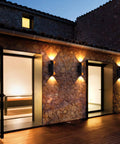 12 Inch Outdoor LED Wall Light Set With Dusk To Dawn Photocell Sensor, illuminated on stone wall, 15W 3000K warm white