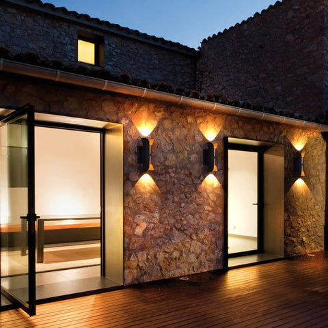 12 Inch Outdoor LED Wall Light Set With Dusk To Dawn Photocell Sensor, illuminated on stone wall, 15W 3000K warm white