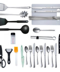 All In One Camping Cooking Utensils Set With 40 Pieces Portable Kitchen Kit For Outdoor Grilling Picnics RV And Car Campers Tent Camping And BBQ Essentials Gear, showing stainless steel cutlery, nylon spatula, and tongs.