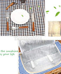 Large Wicker Picnic Basket Set With Waterproof Blanket And Full Go-To Cutlery Kit for camping, ceramic plates on checkered blanket