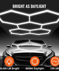 Five Hexagon LED Garage Light Kit With T5 Tube Panels Beastly Bright 6500K Daylight 60,800 Lumens Hexagon Ceiling Light For Garage Workshop Auto Detailing 25 Pack Panels above a car