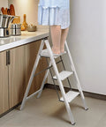 Person using Three Step Aluminum Folding Ladder For Indoor And Outdoor Tasks Space Saving Slim Fold To Four Centimeter Flat
