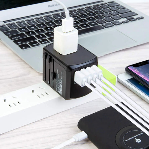 Worldwide Travel Power Adapter With 4 Retractable Plugs, 3 USB Ports And USB C, connected to laptop and smartphone, 100V 240V use