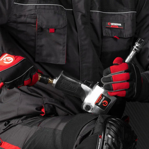 Mechanic using Air Impact Wrench One Half Inch Square Drive With Three Inch Extended Anvil For Lug Nuts And Bolts on vehicle.
