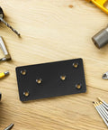 Heavy Duty Black Stainless Steel Corner Braces Rock Solid 10 Pack Flat Straight Brackets For Wood Shelves with tools around it