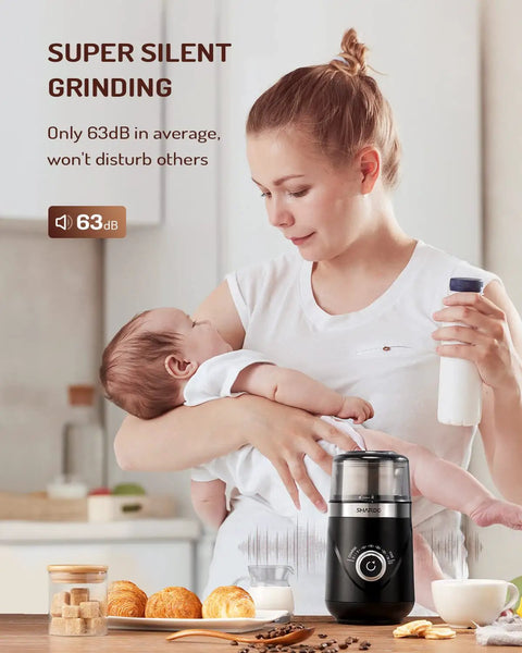 Woman using Electric Super Silent Blade Coffee Grinder With Timed Grind Control Rotary Knob near a sleeping baby