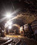 Industrial Grade Construction String Lights LED For Job Sites Renovations Extendable 200 Foot Portable Lighting With Hooks installed in a mining tunnel.