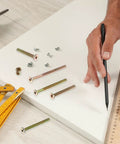 Bulletproof Furniture Connector Bolts And Nuts Kit with copper alloy fasteners and hex socket heads on white surface