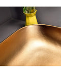 Slick Above Counter Vessel Sink For Modern Bathroom Vanity close-up of the polished gold finish in elegant design.