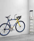 Heavy Duty Garage Storage Hooks Overhead Ceiling Rack 4 Pack Wall Mounted Ladder Hooks Utility Hangers in use with bike and tools