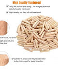 Pile of wood dowel kit with round grooved fluted dowels and drilling jig, 6x40mm pins for furniture building and DIY crafts.