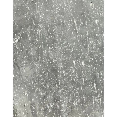 Clear seeded glass detail from Roman Coach Style 1 Light Outdoor Wall Lantern in Textured Black for porch lighting upgrade.