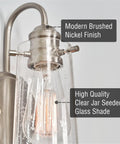 Close-up view of Kira Home Rayne 10" Modern Farmhouse Wall Sconce for Bathroom Vanity showcasing brushed nickel finish and glass shade.