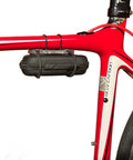 Compact Bicycle Tool Kit With Multi Bit Set mounted on red bike frame, ultra lightweight case secured with Superband for on-the-go use.
