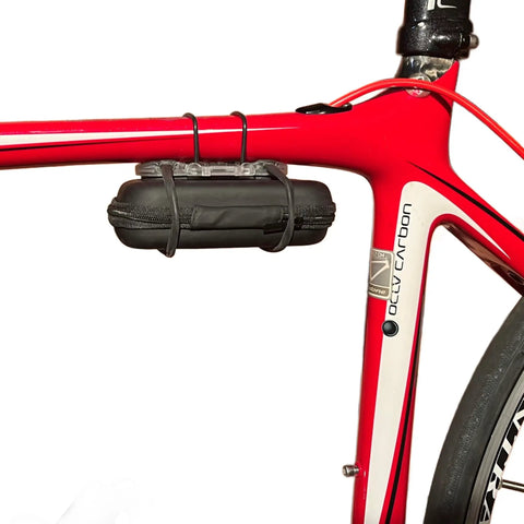 Compact Bicycle Tool Kit With Multi Bit Set mounted on red bike frame, ultra lightweight case secured with Superband for on-the-go use.