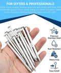 Hand holding stainless steel nails from 530 Piece Pro Grade Stainless Steel Wood Screws And Nails Set With 11 Sizes Phillips Flat Head For Picture Hanging Woodworking DIY Projects Rust Resistant And Burr Free Finish