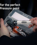 Hands holding syringe from All In One Shimano Hydraulic Brake Bleed Kit For Disc Brakes With 100 Ml Mineral Oil, Gloves And Bleed Block.