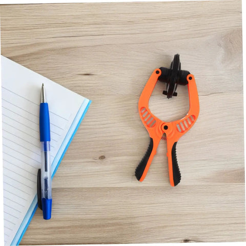 Phone Screen Opening Tool With Durable Suction Cup And LCD Separation Pliers for DIY Repairs on wooden desk