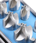 Close-up of eight HSS corner-rounding end mills in a blue foam case, sizes 1/16–3/8 in.