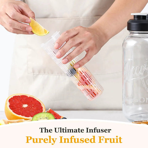 Person placing fruit into infuser next to Fruit Infuser Glass Water Pitcher With Wide Mouth 2 Quart Leakproof No Spill Mason Style Jar Filter Lid.