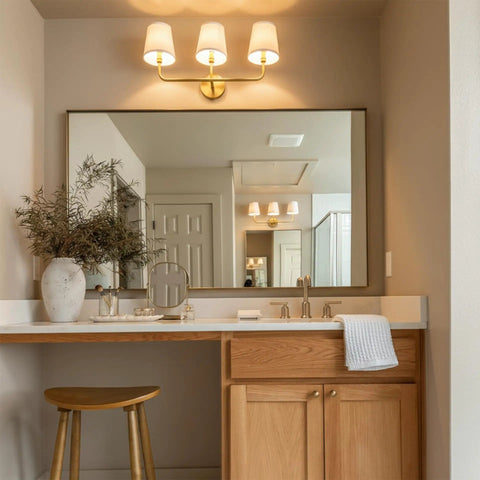 Bathroom with Dawson White Fabric Stay-Straight Shade Bath Vanity Light 3-Light Wall Mount in Aged Brass over mirror