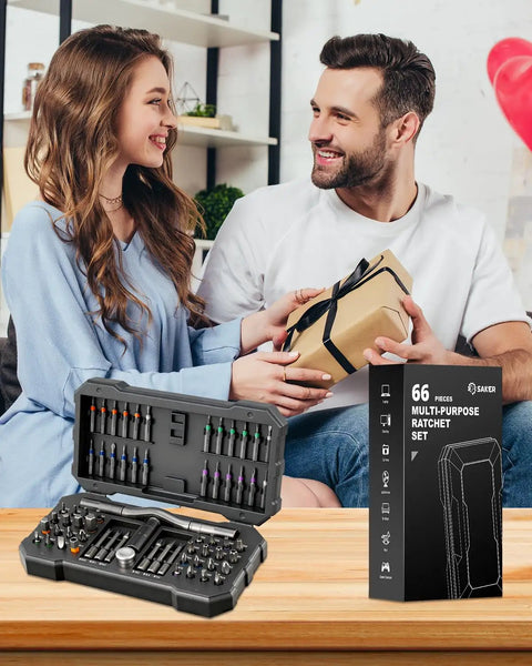 Couple exchanging gift beside All In One Magnetic Screwdriver Set Saker 66 In 1 Portable Ratcheting Kit display box
