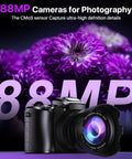 8K Ultra HD Vlogging Camera With WiFi, Autofocus And 88MP Still Photos, black camera in front of purple flowers