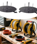 Straight Up Heavy Duty Wire Dispenser Rack And Portable Cable Management Tray Featuring Smooth Rotating Metal Build with spools on a workbench.