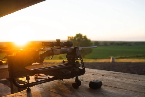 Rifle on a Lead Sled DFT 2 Rifle Shooting Rest with Adjustable Ambidextrous Frame for recoil reduction and stability at sunset.