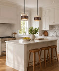 Axamate Wabi Sabi Pendant Light Natural Stone Chandeliers Dia 8" above a kitchen island with wooden stools and stone countertop.