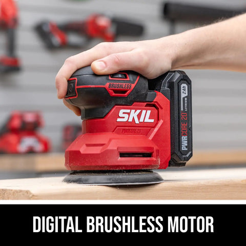 Cordless 20 Volt Brushless Random Orbital Sander Kit With 2 Amp Battery Charger Dust Bag And Sandpaper Packs in use on wood.