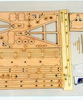 Wooden Trebuchet Desktop Model Kit For Adults A Hardcore Hobby Project pieces and adhesive displayed on a tabletop.