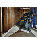 Man pulling Rugged ToughSystem Tool Box With Pull Back Lid For Maximum Storage Non Detachable Lid on a construction site