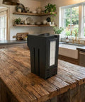 Reusable Self Empty Dust Bin For Roborock Qrevo Curv S5X Robot Vacuum on a wooden kitchen counter with dishes in background.