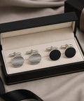 Two Pair Silver Plated French Cufflinks For Men Highlighting Smooth Black Enamel Disks And Crisp Grid Mesh Patterns in a box.