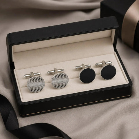 Two Pair Silver Plated French Cufflinks For Men Highlighting Smooth Black Enamel Disks And Crisp Grid Mesh Patterns in a box.