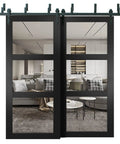 Interior Barn Bypass Sliding Doors With Clear Glass And Solid Wood Black Finish Modern Style 72x96 Inches Workhorse Heavy Duty Sliding Hardware Included Double Door Slabs With Rails Floor Guides And Anti Jump Pins shown in a living room setting.